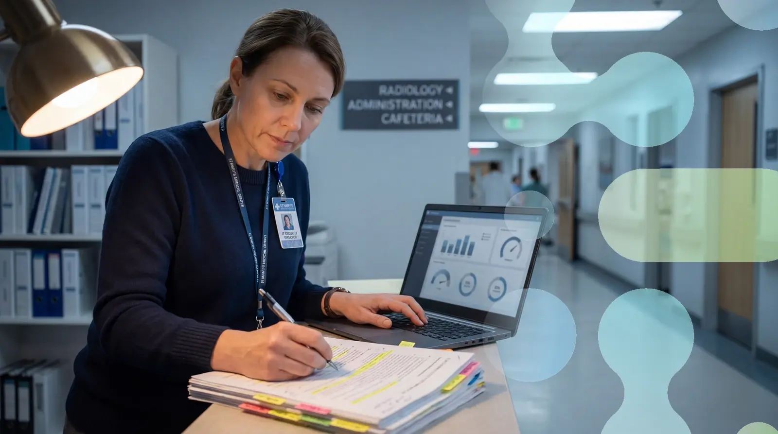 Hospital CISO reviewing HIPAA Security Rule 2026 NPRM compliance requirements at a healthcare administrative workstation