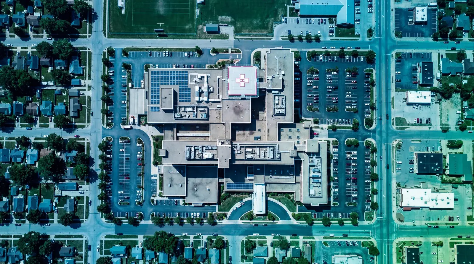 Healthcare microsegmentation aerial view of a regional hospital campus in a midsize town secured by Elisity
